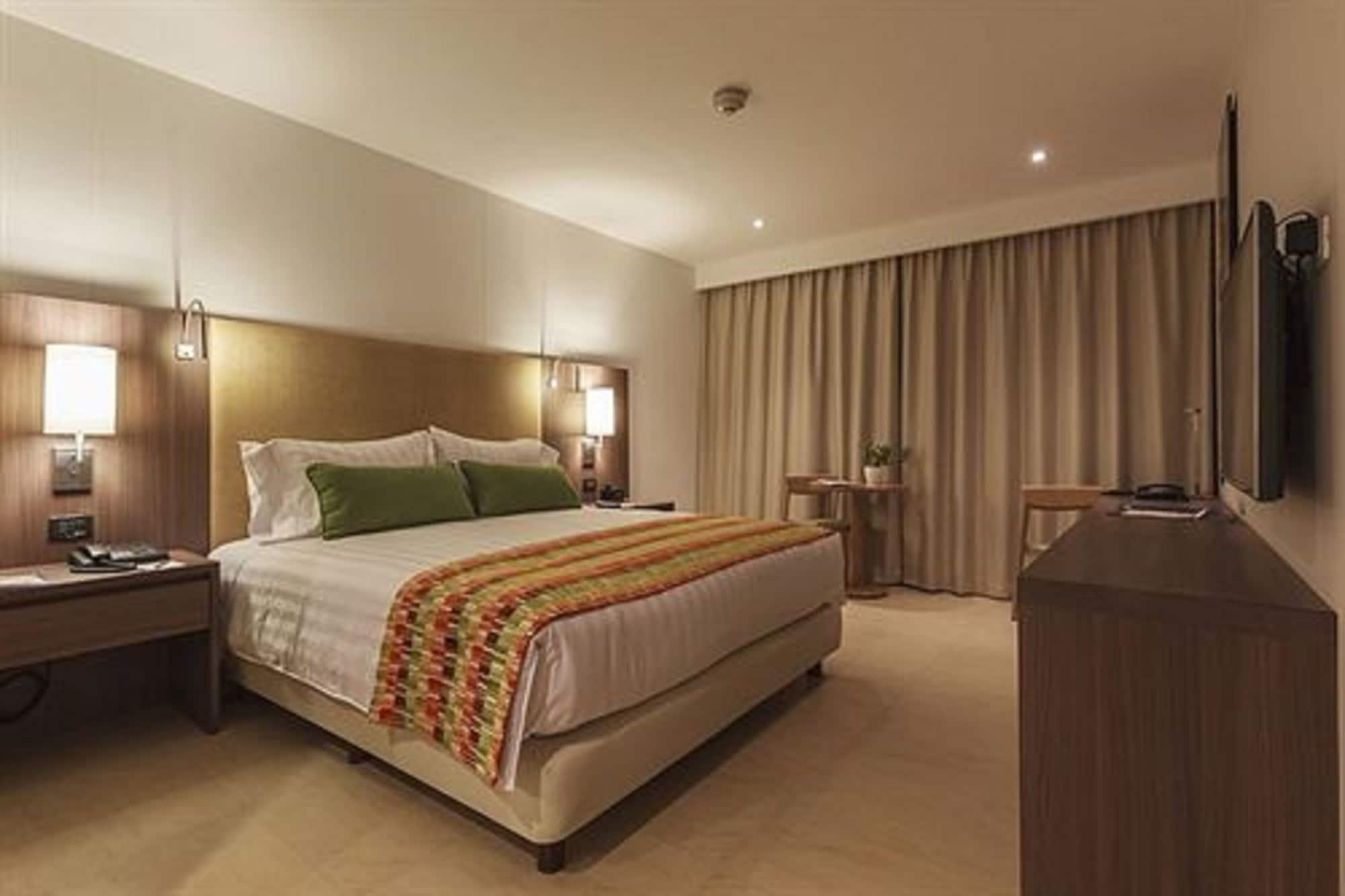 Estelar Villavicencio Hotel & Centro De Convenciones Exterior photo A bedroom at the hotel